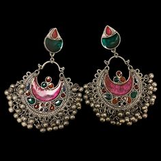 The Pink Gul Chandbali Earrings features intricate flower and peacock design on Oxidized Silver with multicolor crystals. The addition of ghungroos completes the look of this chandbali. Specifications Materials used: Oxidized Silver, Meenakari, Ghungroos At Romikas, we pride ourselves on the craftsmanship and high quality of our jewelry, designed to enhance your natural beauty. Please contact us with any questions. Traditional Multicolor Oxidized Earrings, Multicolor Chandbali Jewelry With Peacock Design, Multicolor Chandbali Earrings For Festival, Multicolor Chandbali Earrings With Intricate Design, Traditional Multicolor Earrings For Navratri, Bohemian Peacock Design Danglers For Diwali, Bohemian Peacock Danglers For Diwali, Multicolor Chandbali Jhumkas With Intricate Design, Multicolor Chandbali Danglers For Festival