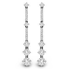 Long, lean and so elegant, these diamond drop earrings will take her breath away. Crafted in 14K white gold, each linear diamond-lined drop features larger diamond stations that catch the eye and add dimension to the designs. A fashion-forward look perfect for the special evening out, these earrings dazzle with 2 cts. t.w. of diamonds and are finished with a bright polished shine. The earrings secure comfortably with friction backs. Luxury White Diamond Linear Earrings, Luxury White Linear Earrings With Diamond Accents, Luxury Linear Earrings With Single Cut Diamonds For Anniversary, White Brilliant Cut Drop Earrings, Formal Dangle Linear Earrings With Single Cut Diamonds, Formal White Gold Linear Earrings With Single Cut Diamonds, White Prong Setting Linear Earrings Fine Jewelry, White Diamond Linear Earrings With Prong Setting, Classic Linear Diamond Earrings With Single Cut