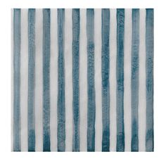 a blue and white rug with vertical stripes