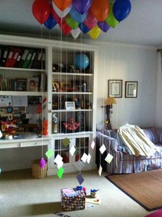 the room is decorated with balloons and bookshelves for children's birthdays