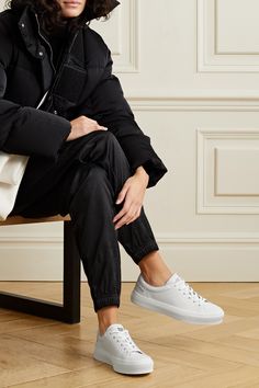 There are few accessories more versatile than a pair of white sneakers, and Givenchy's 'City Court' style is adorned with the house's moniker and '4G' motif that give them an elevated feel. Made from smooth leather, they're traced with tonal topstitching and set on chunky rubber soles. Wear yours with everything from tailoring to feminine dresses. White Keds Outfit, Givenchy Shoes Sneakers, Keds Outfit, White Keds, Givenchy Sneakers, City Sneakers, Feminine Dresses, Givenchy Shoes, White City