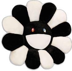 a black and white flower shaped plush toy