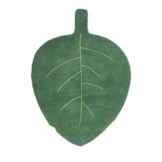 a green rug with a leaf drawn on it