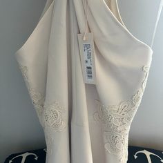 Ivory Peplum Halter Top By Rebecca Taylor, Embroidery On Sides, Great Neckline. Zip Up Back. Tag On, Never Worn. Beautiful Fit For Evening, Suiting, Night Out. Elegant Cream Top With Floral Embroidery, Cream Sleeveless Top For Formal Occasions, Cream Sleeveless Formal Top, Feminine Beige Wedding Tops, Fitted Cream Blouse With Floral Embroidery, Feminine Cream Tops For Wedding, Elegant Embroidered Beige Tops, Beige Wedding Tops With Floral Embroidery, Sleeveless Beige Blouse With Lace Trim