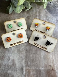 Charming halloween earring stud set!  Candy corn, ghosts, spooky black cats, pumpkins. Earrings are wood and sealed with a glossy resin finish for durability.  These are a perfect gift for someone special! Girls, busy moms, teachers!  Nickel free hardware is used, with a metal and rubber backer to keep earrings in place! The earrings are lightweight and eco friendly! 1/2 inch.  Follow us on Social Media!   IG: www.instagram.com/truelifeconcepts FB: facebook.com/truelifeconcepts.etsy/ Back to the Cute Halloween Earrings For Pierced Ears, Playful Halloween Earrings For Gifts, Playful Halloween Earrings As A Gift, Playful Halloween Earrings For Gift, Lantern Earrings, Spooky Black, Spooky Cute, Earrings For Girls, Treat Gift