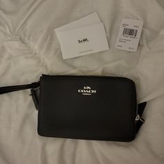 Coach Wristlet. Brand New. Never Used. Still Has Tags But Just Not Attached. Black Clutch Wristlet For Gift, Black Clutch With Wrist Strap Gift, Black Wallet With Wrist Strap For Gift, Black Wallet With Wrist Strap As Gift, Black Wristlet With Zipper Closure For Gift, Black Wristlet With Zipper Closure As Gift, Coach Black Wristlet With Zipper Pouch, Black Pouch Wristlet With Wrist Strap, Black Zipper Pouch Wristlet