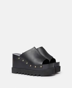 Discover Stella's Black Elyse Studded Slide Wedge Sandals today. Free standard shipping is available on all orders. Shop online now. Black Wedge Sandals, Bags Logo, Stella Mccartney Adidas, Stella Mccartney Elyse, Flat Sneakers, Sneaker Wedge, Espadrilles Wedges, Platform Shoes, Long Wallet