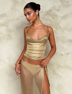 Get our WYNNE TOP in GOLD online now. Shop Tops. Buy now. Pay later with AFTERPAY. Gold Two Piece Outfit, Gold Top Aesthetic, Gold Top Outfit Night, Gold Summer Party Top, All Gold Outfit, Fitted Gold Top For Festivals, Gold Rhinestone Top, Gold Festival Outfit, Gold Festival Sets