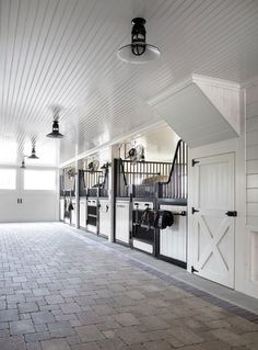 an instagram page showing the interior of a house with white walls and black doors