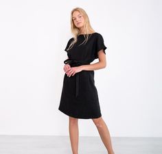 "PENELOPE is an elegant linen dress with belt. DETAILS - Boat neckline - Side seam pockets - Dolman style sleeves - Has self belt - Knee length - 100% midweight European linen fabric - Cut and sewn to order just for you in our studio COLOR - Black, you can also choose other colors above - Fabric samples are available here https://www.etsy.com/listing/586569696/linen-fabric-samples SIZING & FIT - Fits true to size - Length is approximately 36.5 inches / 92.5 cm - Bust is approximately 19.5 in Elegant Belted Linen Dress For Work, Chic Belted Linen Dress For Work, Elegant Short Sleeve Linen Dress With Belt, Linen Tie Waist Dress For Work, Short Sleeve Linen Dress With Tie Waist For Work, Linen Workwear Dress With Tie Waist, Chic Linen Workwear Dress With Tie Waist, Chic Linen Dress With Tie Waist For Work, Linen Summer Dress