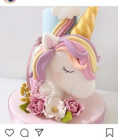 a cake shaped like a unicorn with flowers on it