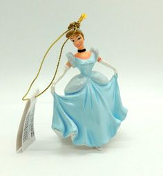 a figurine is wearing a blue dress