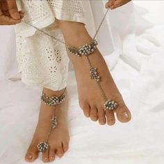 Do you like ghungroos in your anklets or payal? Then, it is the right time to buy these silver payal anklets with beads and dainty chains. This Indian jewelry is very skin-friendly and perfect for festivals, weddings, parties, and traditional occasions. You can gracefully pair a kurti, saree, or any Indo-western outfit to enhance your look with this silver Indian jewelry. The best part about these anklets is that they can be worn for a long period of time without any itching and swelling. Always Festive Bohemian Silver Beads Anklets, Bohemian Festive Anklets With Silver Beads, Bohemian Metal Toe Ring Anklets, Traditional Silver Beaded Anklets, Bohemian Wedding Anklets With Latkans, Silver Beaded Toe Ring Anklets, Bohemian Beaded Metal Body Jewelry, Bohemian Metal Anklets With Silver Beads, Metal Anklets For Festivals Gift