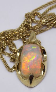 "One of a kind top quality handmade stunning 14k gold Welo 1.8ct AAA opal pendant!! It is an especially precious item, a rare gift to someone that you cherish, a powerful expression of love and friendship. Surprise your special someone with this spectacular opal pendant! This amazing, large opal rainbow boasts a colorful floral pattern with vibrant color rainbow color that changes with every gentle motion. Indirect sunlight, it looks really glamorous and replaces colors .... A truly joyous stone Opal Cabochon Yellow Gold Jewelry, Yellow Gold Opal Cabochon Jewelry, Yellow Gold Ethiopian Opal Cabochon Jewelry, Gold Ethiopian Opal Cabochon Jewelry, Unique Yellow Gold Opal Necklaces, Handmade Yellow Gold Jewelry With Ethiopian Opal, Unique Yellow Gold Opal Necklace, Unique Yellow Gold Ethiopian Opal Jewelry, Opal Bracelet Gold