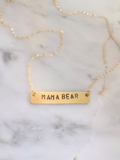 "Personalize this gold bar necklace with any word that has special meaning to you or to a loved one! Give a word of encouragement to someone going through a hard time - \"BRAVE\" Remind her how valuable she is - \"PRICELESS\" Does she light up your day? If so, tell her! - \"SHINE\" Going on a trip? - \"WANDER\" Remind her it's gonna be ok. Keep your chin up - \"HOPE\" ● 16\" chain ● Completely customizable! Just message me! ● Bar measures 40x8mm ● Solid brass bar ● Gold filled chain ● Handmade b Meaningful Everyday Gold Name Necklace, Meaningful Nameplate Necklace For Everyday, Everyday Meaningful Nameplate Necklace, Personalized Gold Bar Necklace For Everyday, Everyday Personalized Gold Bar Necklace, Everyday Rectangular Engraved Bar Necklace, Gold Bar Necklace With Nameplate For Everyday, Gold Bar Necklace With Custom Name, Gold Rectangular Pendant Name Necklace For Everyday