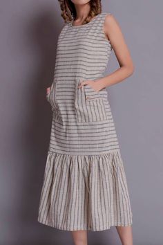 "Linen Maxi, Maxi with patch pocket, Linen Sleeveless Maxi Dress, Beige Dress, Stripes dress for women - Handmade by Modernmoveboutique This dress is available in 2 types of fabrics :- - (S) Solid - (YD) Yarn Dyed >DESCRIPTION< - standard fit - made from Yarn dyed Linen. The fabric is of medium weight (185 g). - the model is 172 cm high (regular XS - S) and is wearing size S. - color or pattern in the picture - BEIGE STRIPES - (YD) YARN DYED (Please choose colors or patterns from drop down Beige Cotton Midi Dress With Pockets, Cotton Sundress With Pockets, Midi Length, Cotton Midi Sundress With Pockets, Beige Cotton Sleeveless Midi Dress, Sleeveless Cotton Sundress With Pockets, Sleeveless Cotton Maxi Dress With Pockets, Beige Sleeveless Midi Cotton Dress, Casual Beige Dresses With Slip Pockets, Casual Beige Dress With Slip Pockets