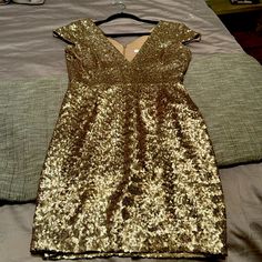 Perfect Party Dress For The Holiday. It’s Brand New Without The Tags. Gold V-neck Sequin Dress For Formal Occasions, Gold Sequin Midi Dress For Formal Occasions, Formal Gold Sequin Midi Dress, Glamorous Holiday Sheath Dress, Gold Midi Dress For Cocktail Holiday, Glamorous Sheath Dress For Holiday, Glamorous Sheath Holiday Dress, Gold Holiday Cocktail Midi Dress, Sheath Cocktail Dress For Party Season