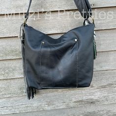 "This is the perfect bag!! Made with Pendleton wool and a perfect black distressed leather, this bag is the bag that every gal neeeeeds! The back leather patch pocket is perfect for your keys and phone! The back of the bag you will receive has black leather on the back and for the back pocket. For the interior, I used a cotton fabric that I interfaced for durability. The interior features 2 slip pockets and a zipper pocket. A zipper closes the bag. The strap is adjustable for cross body/ shoulde Fall Leather Hobo Bag, Leather Satchel With Zipper Pocket For Fall, Everyday Shoulder Bag With Leather Trim For Fall, Fall Leather-backed Satchel Bag, Fall Satchel Bag With Leather Backing, Leather Hobo Bag For Fall, Fall Black Hobo Bag For On-the-go, Leather Hobo Bag With Pockets For Daily Use, Everyday Fall Bags With Leather Trim