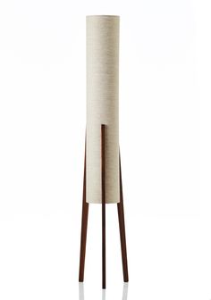 the floor lamp is made out of wood and fabric