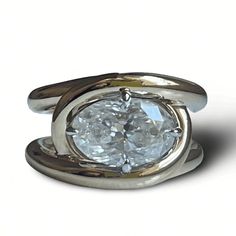 "Lower prices on our main website: https://discomarshmallow.myshopify.com/ Indulge in vintage-inspired elegance with our Oval Ring, featuring a 5-carat oval moissanite cradled delicately in a dual-tone 14k yellow and white gold interlocking loops claw setting. This design pays homage to the timeless allure of 1950s French rings. Item Details * Made to Order. * Gold Kt: 14K Solid Gold * Cut: Oval * Setting Type: Claw * Ready to Ship in 15-20 business days If you have any additional questions about this ring, just hit the \"Ask a Question\" button (just to the right of the price) and we will get back to you within a few hours. Be sure to hit \"favorite\" on the right so it remains in your favorites list and/ or add to your wish list(s). Thank you for taking the time to look at my shop. I hop Modern Oval Diamond Ring With Vs Clarity, Oval White Topaz Jewelry For Wedding And Anniversary, Oval White Topaz Diamond Ring For Anniversary, Modern Oval Moissanite Jewelry, Modern Oval Platinum Diamond Ring, Formal Oval Wedding Ring With Rose Cut Diamonds, Heirloom Oval Diamond Ring With Vs Clarity, Modern Moissanite Oval Diamond Ring, Modern Oval Diamond White Diamond Ring