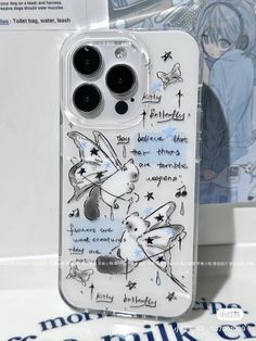 an iphone case with some writing on it and two buttons in the back that are attached to