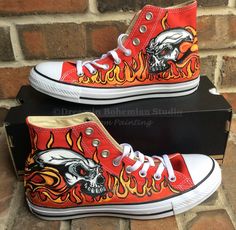 Hand Painted High Tops with Fiery Skulls with Flames exploding in the background on bright red hi top Chucks. So cool! This design was a custom order as a gift for my client's nephew. She wanted my super popular flames design and wanted to add a skull graphic that she had found. They turned out really cool and her nephew LOVED them. I can paint this design on other color Chucks as well. Change up the design however you would like to, I love customs! Here is the Flame Converse I also have listed: Converse Custom Art, Painted Converse High Tops, Hd 883 Iron, Painted Flames, Custom Converse Shoes, Painted Converse, Converse Tennis Shoes, Converse Custom, Custom Painted Shoes