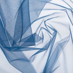 an abstract blue background with wavy lines and curves in the center, on white fabric