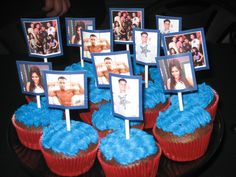 cupcakes decorated with pictures and blue frosting