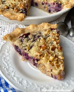 two white plates topped with pie on top of a table