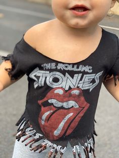 Rolling Stones distressed t-shirt. These are made to order: -All shirts are unique, no two shirts will be identical because of distressing -shirts comes with a raw edge Distressed Crew Neck Top For Festival, Edgy Summer Tops With Frayed Hem, Acid Wash Short Sleeve Tops With Frayed Hem, Stonewashed Cotton Band Merch Tops, Edgy Stonewashed Cotton Tops, Edgy Cotton Tops With Frayed Hem, Edgy Cotton Top With Frayed Hem, Acid Wash Cotton Top For Festivals, Distressed Graphic Tee For Festival