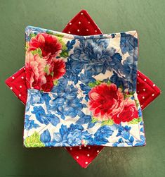 three red, white and blue flowered napkins on top of each other