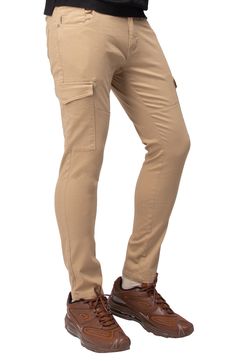 Solid chino pants constructed from comfortable stretch twill feature roomy cargo pockets for contemporary style. 13" leg opening; 9 3/4" front rise (size 32x32) Zip fly with button closure Five-pocket style Leg cargo pockets Skinny leg Stretch twill construction 64% cotton, 33% polyester, 3% spandex Machine wash, tumble dry Imported Model stats: 6'1" height, 32" waist. Model is wearing size 32x32. Fitted Cotton Cargo Pants With Flap Pockets, Khaki Tapered Leg Chino Cotton Twill Cargo Pants, Chino Cotton Twill Cargo Pants With Tapered Leg, Fitted Chino Cotton Twill Cargo Pants With Tapered Leg, Tapered Leg Chino Twill Work Pants With Side Pockets, Stretch Full-length Chinos With Pockets, Stretch Full Length Chinos, Utility Chino Cotton Twill Cargo Pants Straight Leg, Straight Leg Chino Cotton Twill Cargo Pants