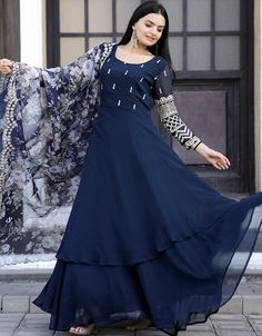 🌟 Embrace the allure of the night with our Navy Blue Faux Blooming Gown! ✨ Elevate your style with this mesmerizing gown, perfect for adding a touch of grace and charm to your special occasions and celebrations. 💙👗 #FauxBloomingGown #NavyBlueElegance #ChicFashion #SpecialOccasions #CelebrateInStyle Blue Embellished Georgette Anarkali Set, Blue Embellished Sets In Georgette, Blue Embellished Georgette Sets, Blue Georgette Gown With Long Sleeves, Fitted Blue Sharara With Floral Embroidery, Blue Georgette Maxi Length Set, Blue Floral Embroidered Semi-stitched Gown, Fitted Blue Gown With Floral Embroidery, Blue Georgette Dress With Traditional Drape