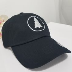 This hat is made in the USA, so wear it proud! It's unstructured with a curved visor and adjustable strap, and an American flag sewn on the back. PINE TREE Hat / Wildlife Cap / Hiking Baseball Cap / Adventure Custom Embroidery / Best Friend Gift / Camping Embroidered Hat / Forest Woods * 100% washed cotton chino twill * Unstructured, 6-panel, low-profile * Adjustable strap with hide-away buckle - US FREE SHIPPING! - High Quality - Closure: Self-fabric adjustable strap slide closure with buckle. Winter Baseball Cap With Embroidered Logo And Curved Brim, Embroidered Snapback Baseball Cap For Outdoor, Winter Baseball Cap With Embroidered Logo, Winter Snapback Baseball Cap With Embroidered Logo, Casual Hats With Custom Embroidery And Curved Bill, Embroidered Snapback Hats For Outdoor, Outdoor Embroidered Hat With Curved Brim, Embroidered Curved Brim Hat For Outdoor, Embroidered Trucker Hat With Curved Visor