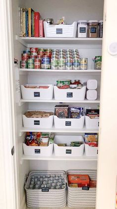 an organized pantry with white bins filled with food