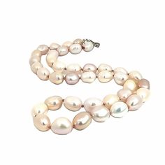 This stunning Freshwater Pearl necklace, meticulously strung and knotted on silk pink thread, ends with Stacy's sterling silver leaf print toggle. The leaf toggle, a beauty in sterling silver, is a testament to the quality of our craftsmanship. The pearls, each a top-quality pearl, are a testament to our commitment to providing you with the best, ensuring that this necklace is a unique masterpiece, a treasure you won't find anywhere else. The necklace measures 17.25" long.Freshwater Pearls are a Silver Hand Knotted Adjustable Necklace, Adjustable Silver Hand Knotted Necklace, Silver Hand Knotted Necklace For Gift, Silver Hand-knotted Necklace For Gift, Elegant Silver Hand Knotted Necklace, Elegant Silver Hand-knotted Necklace, Elegant Hand Knotted Silver Jewelry, Elegant Hand Knotted Silver Necklace, Elegant Hand-knotted Silver Jewelry