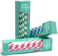 three different colored paper straws in boxes