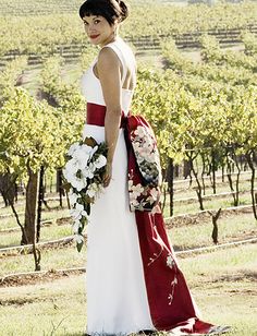 a woman in a white and red wedding dress