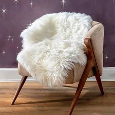 Lend your home a little easygoing luxury.  Our Single New Zealand  Sheepskin Rug with Long Wool is made of lustrous, 2.56" pile and features a natural shape that's sure to enhance any décor.  Each piece is unique and oozes quality, this rug will add a cosy feel to sparce areas. Lay it by the fireside or drape it over a chair - either way, it will look and feel superb. Made of fine New Zealand sheepskin and crafted in the UK. Specifications: Premium-grade New Zealand sheepskin with a minimum leng Sheepskin Rug, Ivory White, Natural Shapes, About Uk, New Zealand, Floor Rugs, Home And Living, Flooring, Display Homes