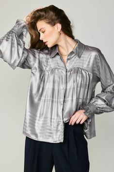 This gently crinkled metallic top instantly dresses up any look. It's got a pointed collar, hidden button placket, and gathered piecing at the bodice and sleeves. Ruffled cuffs add to the wow factor. •Pointed collar •Concealed button placket •Dolman sleeves •Ruffled cuffs with double-button fastening •Gathered piecing at bodice & sleeves •Relaxed fit item number 2330093 100% Polyester Long Sleeve Blouse Designs, Suede Pants, Pleated Shirt, Halloween Sale, Wow Factor, Woven Top, Fashion Updates, Wow Products, We Wear