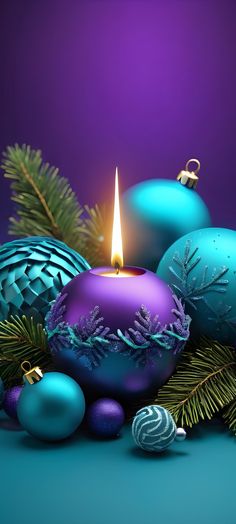 blue and purple christmas ornaments with a lit candle