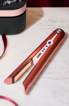 What it is: Special edition Dyson Corrale styler straightener in strawberry bronze and blush pink with complimentary Presentation case. What it does: An innovative cord-free styler and straightener with flexing plates that shape to gather hair, allowing for enhanced styling with less heat and half the damage.¹ It's cord-free with the thermal performance of a corded straightener. Go from curls and waves, to smooth and sleek with flexing plates. Intelligent heat control responds to the thickness, texture, and length of your hair and automatically controls the temperature for optimal styling results.Features and benefits:- Less heat, half the damage: flexing plates gather your hair for more control, so you can achieve the same style with less heat and 50% less breakage.¹- Up to 30 minutes cor Lange Hair Tools, Dyson Straightener, Dyson Corrale Straightener, Straightener Curls, Dyson Corrale, Hair Dryer Straightener, L'ange Hair, Dyson Hair Dryer, Hair Iron