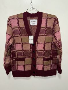 Elevate your winter and fall wardrobe with this stunning Re/Done cardigan sweater in a beautiful mulberry pink plaid pattern. The long sleeve piece features an oversized fit, making it perfect for layering over your favorite tops. Crafted from soft alpaca wool material, this sweater will keep you cozy throughout the colder months. The vintage-inspired 90s theme adds a touch of nostalgia to your outfit, while the brand Re/Done ensures top-quality design. This sweater is available in size S and is suitable for regular-size wearers. Don't miss out on the chance to add this unique piece to your wardrobe, perfect for any casual or dressy occasion. Pink Plaid Pattern, Alpaca Cardigan, 90s Theme, Pink Plaid, Alpaca Wool, Fall Wardrobe, Plaid Pattern, Cardigan Sweater, Alpaca