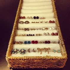 a wicker basket filled with lots of jewelry