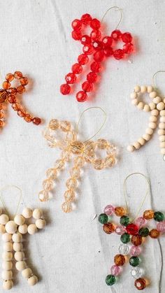 beaded cross ornaments are arranged on a table