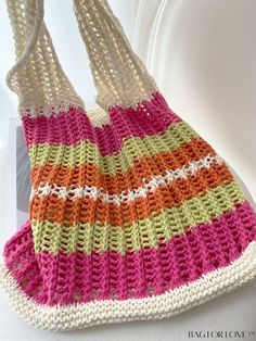 a crocheted bag hanging from a hook