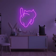 a purple neon sign in the corner of a room next to a white dresser and chair