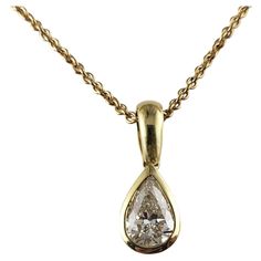 Vintage 14 Karat Yellow Gold Diamond Solitaire Necklace JAGi Certified- This lovely pendant necklace features one pear shaped diamond set in classic 14K yellow gold. Diamond weight: .92 ct. Diamond color: H Diamond clarity: VS2 Size: 22.5 inches (necklace) 18 mm x 7 mm (pendant) Weight: 7.5 gr./ 4.8 dwt. JAGi Certificate included. Very good condition, professionally polished. Will come packaged in a gift box or pouch (when possible) and will be shipped U.S. Priority Mail Insured. DV042423/17KCS Classic Yellow Gold Pear Shaped Diamond Necklace, Formal Yellow Gold Pear-shaped Diamond Necklace, Formal Pear-shaped Yellow Gold Diamond Necklace, Pear-shaped Yellow Gold Diamond Necklace, Classic Yellow Gold Pear-shaped Solitaire Necklace, Classic Yellow Gold Pear-shaped Diamond Necklace, Classic Pear-shaped Solitaire Necklace With Diamond Accents, Classic Pear-shaped Solitaire Necklace In Yellow Gold, Classic Pear-shaped Yellow Gold Solitaire Necklace