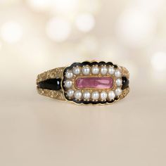 A Beautiful Antique Georgian Era Ring Featuring A Portrait Cut Pink Topaz And Seed Pearl Halo. Antique Pearl Ring With Gemstone, Antique Pink Rose Cut Diamond Jewelry, Antique Pink Jewelry With Rose Cut Diamonds, Victorian Pink Rose Cut Diamond Jewelry, Vintage Pink Cabochon Ring, Heirloom Pink Jewelry With Bezel Setting, Pink Heirloom Jewelry Collectible, Pink Topaz Ring, Estate Diamond Jewelry