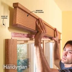 a man is working on a window with the top casing and bottom casing